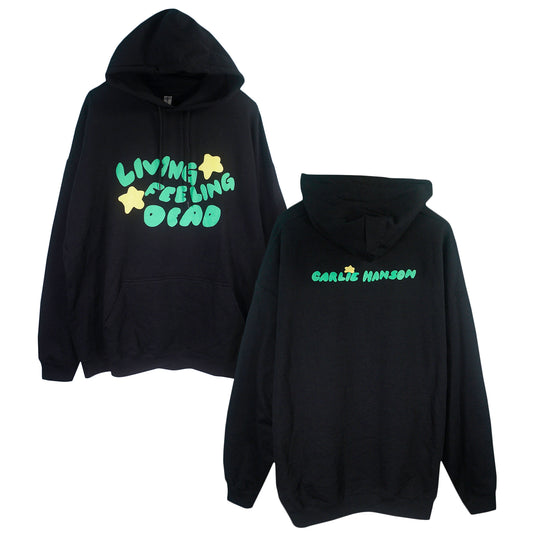 The Living Feeling Dead - Black Pullover is shown front and back. The front has green bubble letters with yellow stars saying Living, Feeling, Dead. The back shows green GARLIC HANSON text and a yellow star above. Style code: 608.
